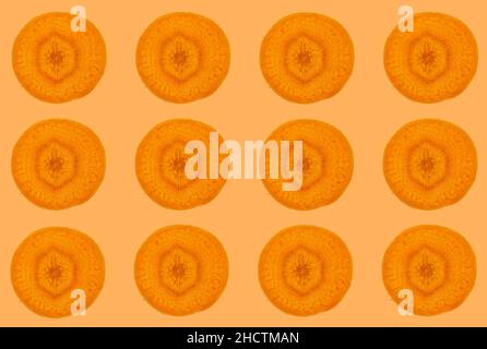 Carrot slices, top view of carrot slices isolated on orange background. Fruit seamless pattern concept idea photo. Stock Photo