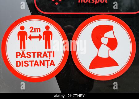 Bucharest, Romania - June 6, 2020: Mandatory 2 meters social distancing and medical protection mask at the entry into a store, to mitigate the spread Stock Photo