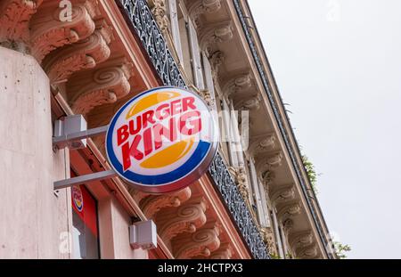 Burger King sign on a building. Burger King, often abbreviated as BK, is a global chain of hamburger fast food restaurants,United States. Stock Photo