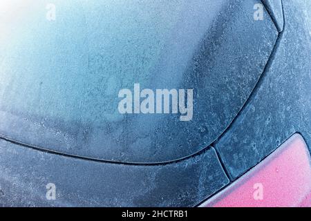 car rear window completely covered with ice at the winter Stock Photo