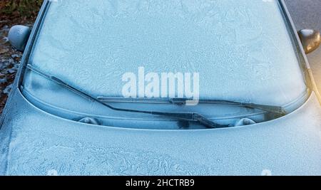 car windshield covered completely with ice and snow Stock Photo