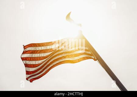 USA symbol. United States of America flag on a pole waving isolated ...
