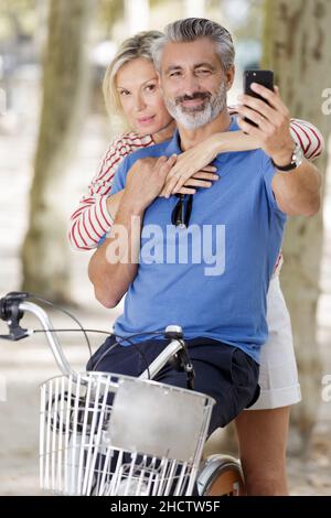 mature couple taking selfie outdoors Stock Photo