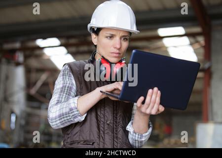 a worker using pc indoors Stock Photo