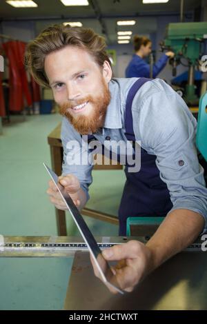 side view of worker looking at camera Stock Photo