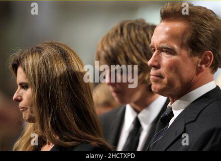 Boston, MA - August 29, 2009 -- Maria Shriver, left, and her husband California Governor Arnold Schwarzenegger, right, during funeral services for U.S. Senator Edward Kennedy at the Basilica of Our Lady of Perpetual Help in Boston, Massachusetts August 29, 2009. Senator Kennedy died late Tuesday after a battle with cancer. Credit: Brian Snyder- Pool via CNP Stock Photo
