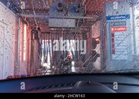 a car Running through automatic car wash Stock Photo