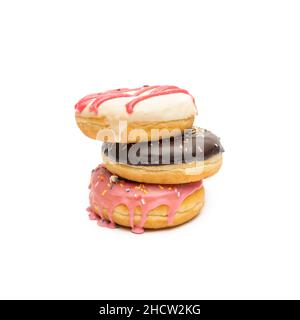 pile of assorted donuts with chocolate and sugar coatings and sprinkles, isolated on white background Stock Photo