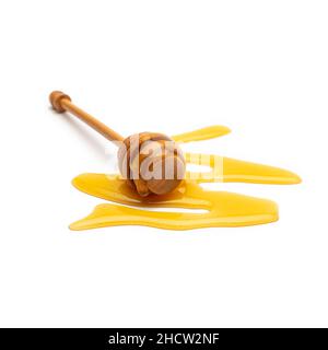 Honey dipper with fresh honey isolated on white background Stock Photo