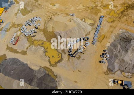 Concrete drainage pipe pile waiting install in construction site of pipelines for sewage Stock Photo