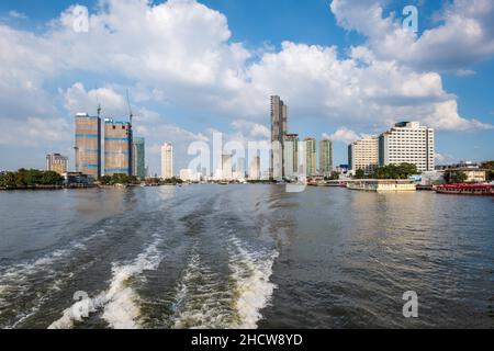 Bangkok, Thailand - December 2021: Chao Phraya River view and Bangkok skyline in Thailand. Downtown skyline and river cityscape Stock Photo