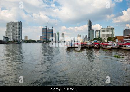 Bangkok, Thailand - December 2021: Chao Phraya River view and Bangkok skyline in Thailand. Downtown skyline and river cityscape Stock Photo