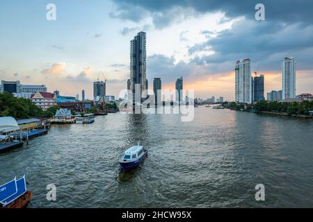 Bangkok, Thailand - December 2021: Chao Phraya River view and Bangkok skyline in Thailand. Downtown skyline and river cityscape Stock Photo