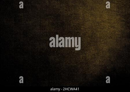 Golden color shiny dark concrete plaster wall with grunge texture for background Stock Photo