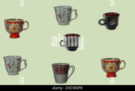 Trendy dishes pattern made with tea cups. Several cups on a light green background. Stock Photo