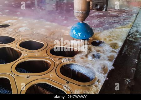 CNC water jet cutting machine is a modern industrial technology for cutting any material Stock Photo