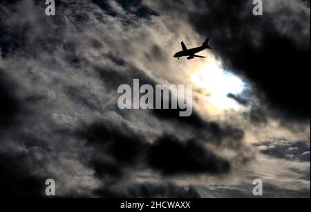 A plane with wheels down heading for Reagan National Airport, in Washington, DC. Stock Photo