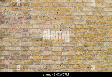 old yellow brick wall Background texture Stock Photo