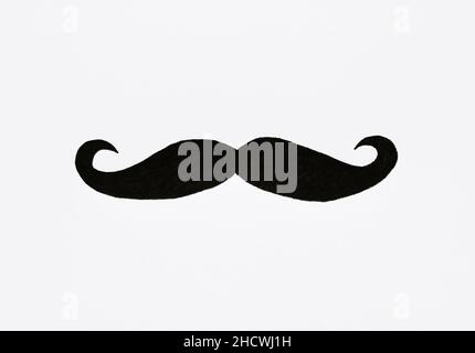 Overhead of a drawing of a moustache on white paper or background Stock Photo