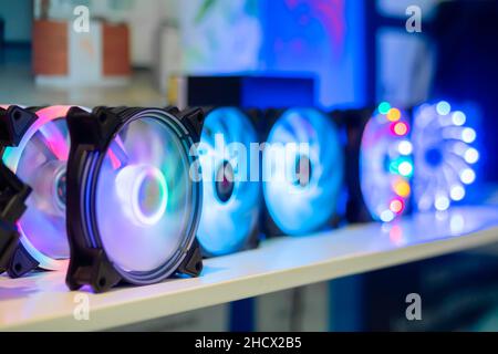 Many colorful coolers, cooling fans with neon LED light at computer exhibition Stock Photo