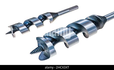 Close-up of auger drill bits for wood isolated on a white background. Metal fluted drilling tools of two sizes with tapered screw thread on center tip. Stock Photo