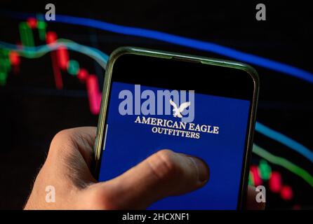 China. 4th Dec, 2021. In this photo illustration the American clothing and accessories retailer American Eagle logo seen displayed on a smartphone with an economic stock exchange index graph in the background. (Credit Image: © Budrul Chukrut/SOPA Images via ZUMA Press Wire) Stock Photo