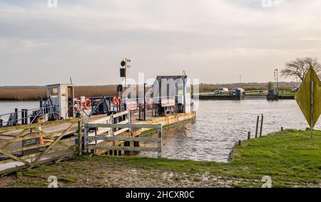 Reedham, Norfolk, UK – January 2022. The Reedham ferry, a vehicular chain ferry which crosses the River Yare in the village of Reedham Stock Photo