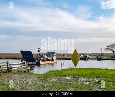 Reedham, Norfolk, UK – January 2022. The Reedham ferry, a vehicular chain ferry which crosses the River Yare in the village of Reedham Stock Photo