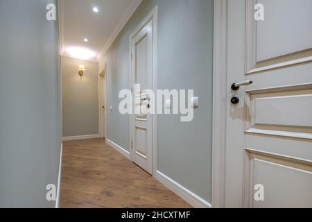 long empty corridor in interior of entrance hall of modern apartments, office or clinic Stock Photo