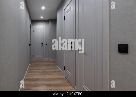 long empty corridor in interior of entrance hall of modern apartments, office or clinic Stock Photo