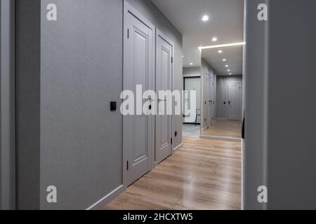 long empty corridor in interior of entrance hall of modern apartments, office or clinic Stock Photo