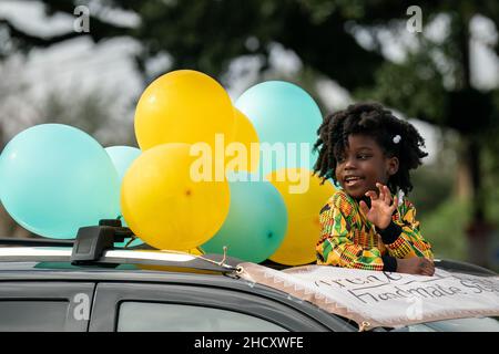 Charleston, United States Of America. 02nd Jan, 2022. Charleston, United States of America. 02 January, 2022. Journee Duncan, 6, waves from a float during the 156th annual Emancipation Proclamation parade celebrating the freeing of African-American slaves, January 1, 2022 in Charleston, South Carolina. The parade has been held on New Year Day since 1866 and is the oldest parade in the country commemorating the day President Abraham Lincoln abolish slavery. Credit: Richard Ellis/Richard Ellis/Alamy Live News Stock Photo