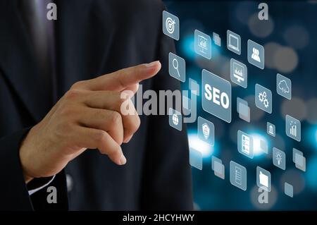 businessman hand touching a virtual screen, business icon. SEO Search engine optimization  Business Technology Concept Marketing Ranking  Website Inte Stock Photo