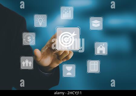 businessman hand touching a virtual screen. Planning the way to achieve the goal to success. Vision and concept of business goals Strategy development Stock Photo