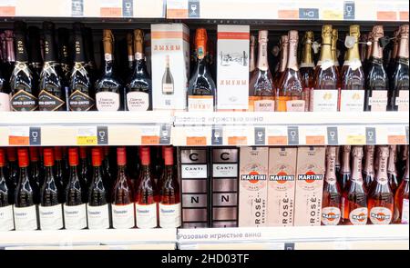 Shelves aisles with rose champagne sparkling wine alcohol liquor spirits, drinks on a shelf products in Lenta supermarket, St petersburg, Russia Stock Photo