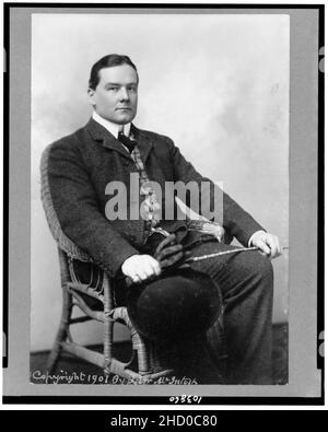 Richard Harding Davis, full-length portrait, seated, facing right Stock Photo
