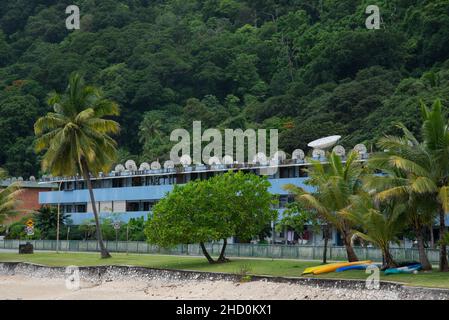 Satellite dishes adorn the roof of an apartment building in the kompongs of Flying Fish Cove on Christmas Island. Stock Photo