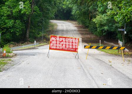 Traffic information sign closing the road during the annual red crab migration on Christmas Island. Stock Photo