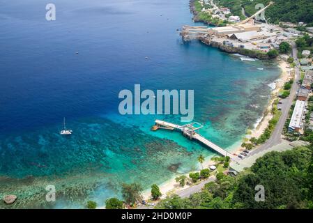 The jetty, coral reef and infrastructure of Flying Fish Cove on Christmas Island. Stock Photo