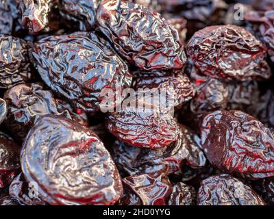 Stack of organic dried plums or prunes. Stock Photo