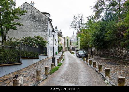 View of old cobblestone streets of Montmartre district in Paris Stock Photo