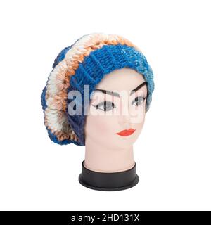 Portrait of woman on white background wearing woolen accessories Stock Photo
