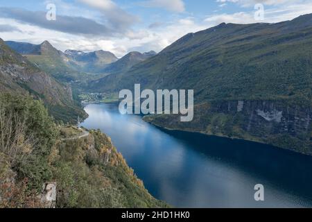Late autumn afternoon in the Geiranger Fjord in Norway. More og Romsdal county. Famous Norwegian landscape landmark. Viewpoint above Geiranger. Stock Photo