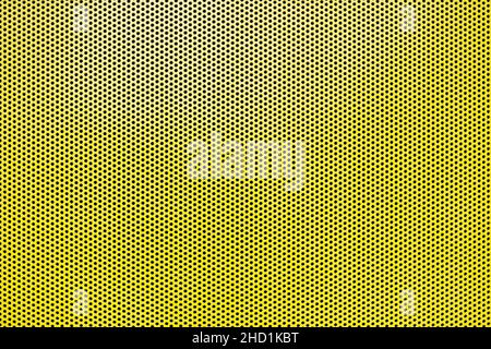 metal grate or perforated sheet metal painted yellow Stock Photo
