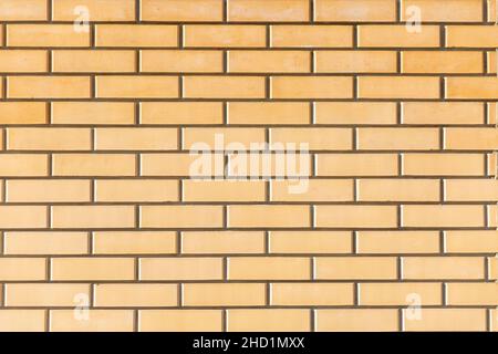 natural geometric texture of yellow Brick Wall Stock Photo