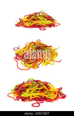 Tasty jelly spaghetti isolated on white background. Candy stripes. Stock Photo