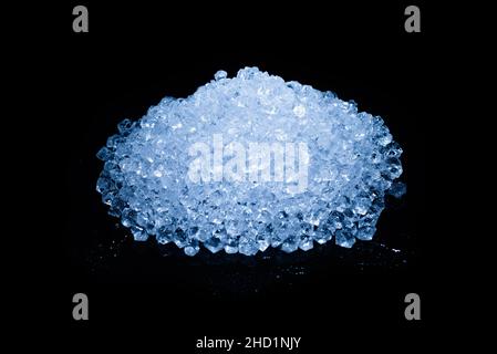 Ice crystal cubes on a black background, space for text or design. Stock Photo