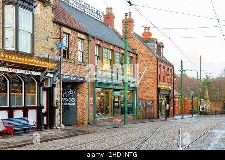 row of reconstructed victorian properties and shops at Beamish Village including the sun inn and newspaper printing shop Stock Photo