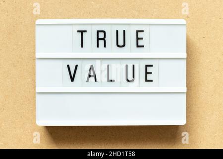 Lightbox with word true value on wood background Stock Photo