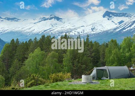 VALLDAL, NORWAY - 2020 JUNE 14. Hiking adventure with tent in the Norwegian nature. Stock Photo